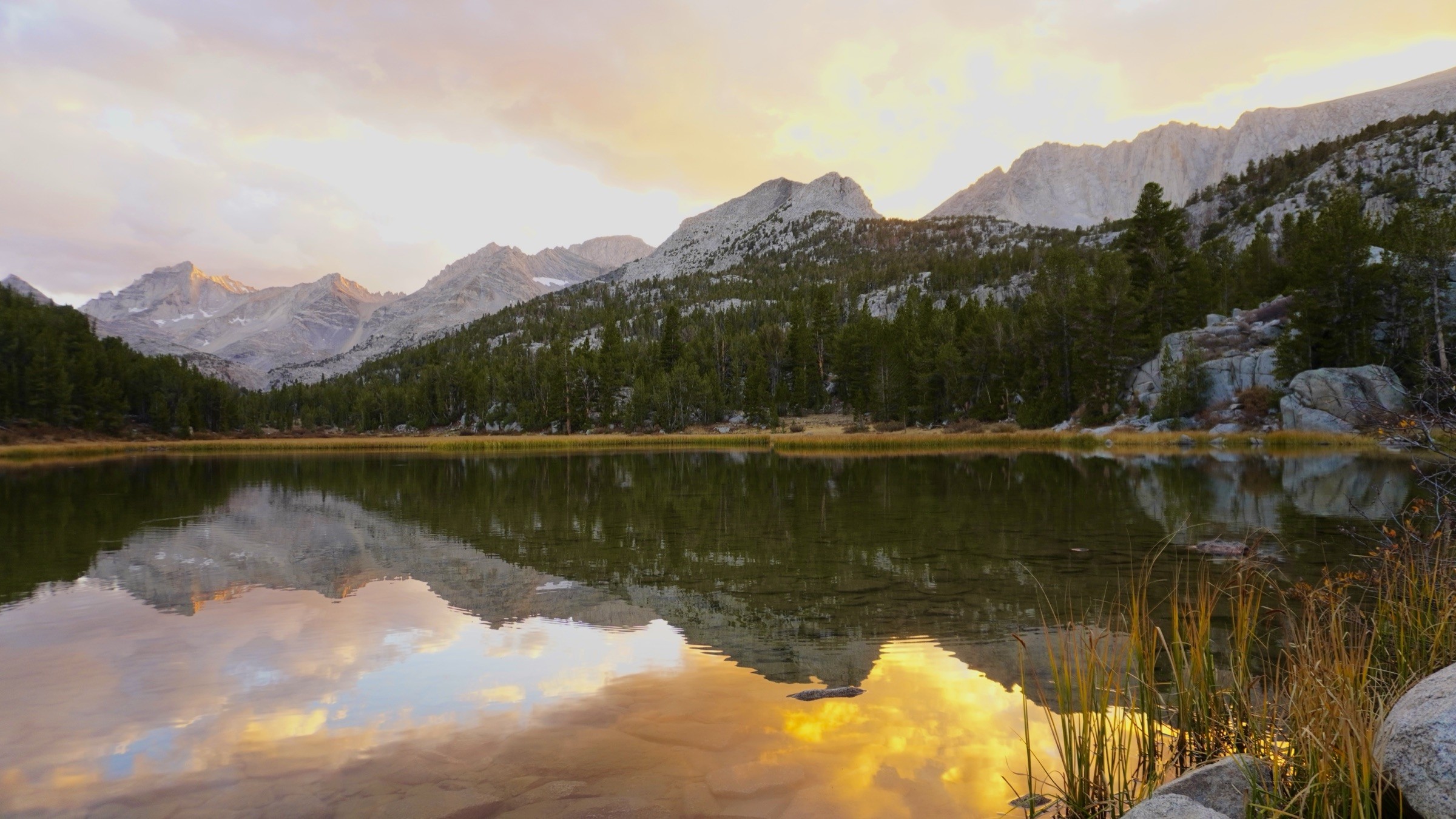 Sunset reflected in Marsh Lake beneath the mountains of Little Lakes Valley in California's Eastern Sierra